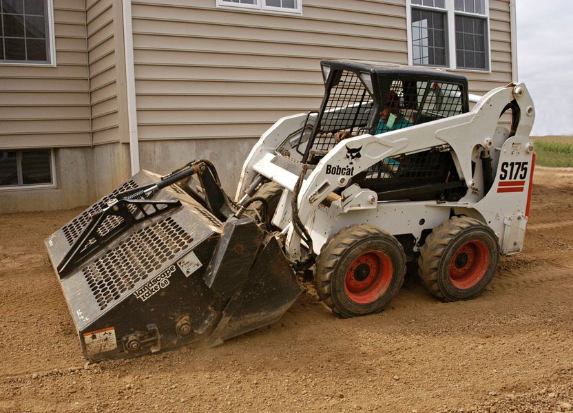 Land clearing and leveling project by Mike's Bobcat Service